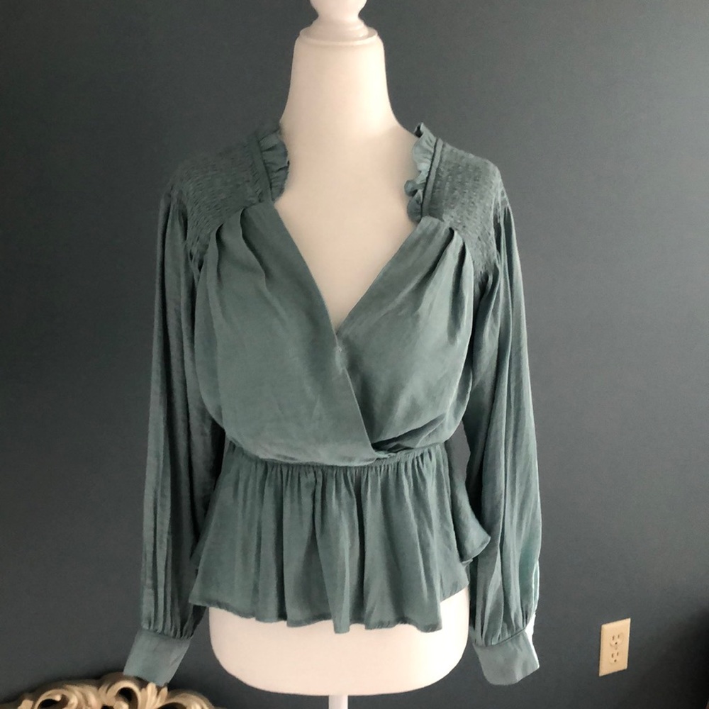 Super feminine blouse with really pretty details. Worn once in perfect condition